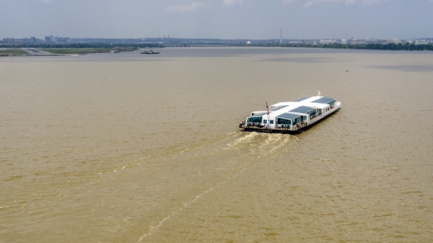 AXP074_000_0002F - Aerial stock photo of A ferry boat on the Potomac River near Arlington, Virginia