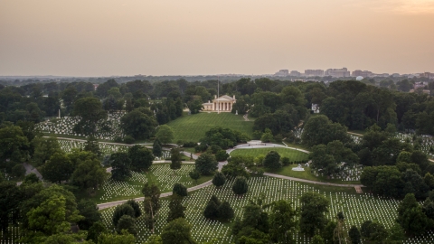AXP076_000_0025F - Aerial stock photo of Rows of gravestones near Arlington House at Arlington National Cemetery, Arlington, Virginia, twilight
