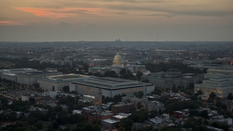 AXP076_000_0030F - Aerial stock photo of The United States Capitol behind the Russell, Dirksen and Hart Senate Office Buildings, Washington, D.C., twilight
