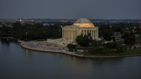 AXP076_000_0035F - Aerial stock photo of The Jefferson Memorial lit up at twilight in Washington, D.C.