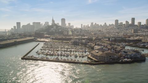 DCSF05_070.0000597 - Aerial stock photo of Pier 39 and marina, San Francisco skyline in background, San Francisco, California