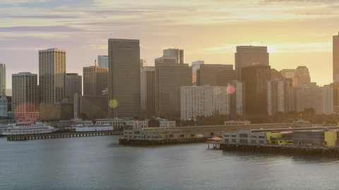 DCSF07_015.0000091 - Aerial stock photo of The downtown skyline, seen from piers on the bay, Downtown San Francisco, California, sunset