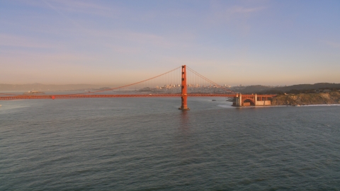 DCSF07_048.0000059 - Aerial stock photo of The Golden Gate Bridge with Downtown San Francisco skyline behind it, California, sunset