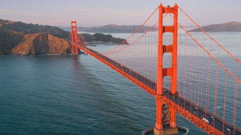 DCSF07_053.0000562 - Aerial stock photo of The Golden Gate Bridge, Marin Headlands behind it, San Francisco, California, sunset