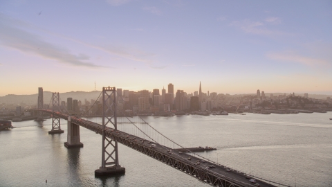 DCSF07_070.0000279 - Aerial stock photo of The Bay Bridge with a view of Downtown San Francisco skyline, California, twilight