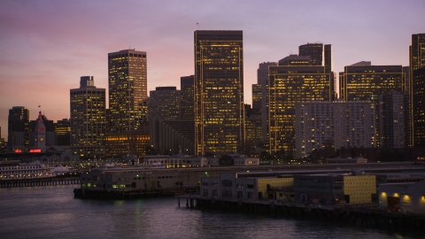 DCSF07_087.0000247 - Aerial stock photo of The skyline of Downtown San Francisco seen from piers on the shore, California, twilight