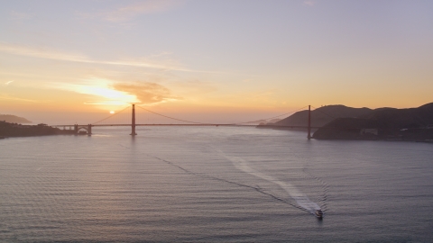 DCSF10_025.0000033 - Aerial stock photo of Setting sun behind the Golden Gate Bridge, San Francisco, California, sunset