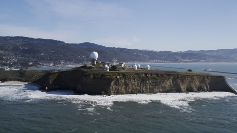DFKSF15_068.0000333 - Aerial stock photo of The Pillar Point Air Force Station near coastal hills in Half Moon Bay, California