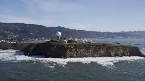 DFKSF15_068.0000345 - Aerial stock photo of Pillar Point Air Force Station by steep cliffs in Half Moon Bay, California