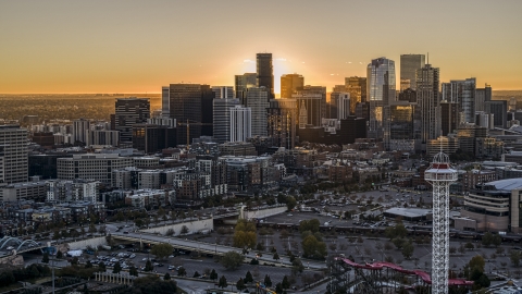 DXP001_000092 - Aerial stock photo of Sunrise behind the city's skyline in Downtown Denver, Colorado