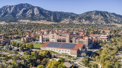DXP001_000204 - Aerial stock photo of Buildings at the University of Colorado Boulder campus and mountains in the background, Boulder, Colorado