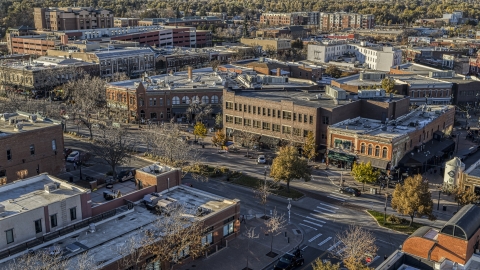 DXP001_000243 - Aerial stock photo of Shops and brick office buildings beside a quiet street in Fort Collins, Colorado