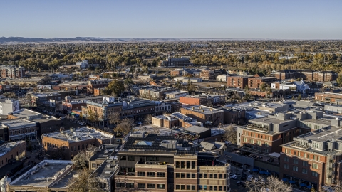DXP001_000247 - Aerial stock photo of A view across the tops of brick office buildings and small shops in Fort Collins, Colorado