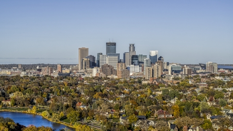 DXP001_000317 - Aerial stock photo of Lakefront homes and city skyline seen from Lake of the Isles, Downtown Minneapolis, Minnesota