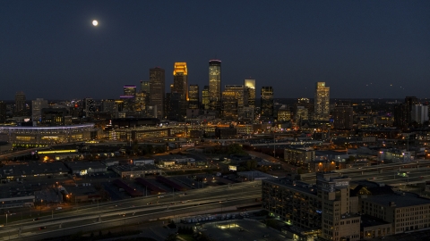 DXP001_000351 - Aerial stock photo of The downtown skyline at twilight and the moon in the sky above, Downtown Minneapolis, Minnesota