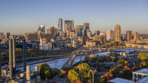 DXP001_000353 - Aerial stock photo of The downtown skyline across the river, seen from a bridge at sunrise, Downtown Minneapolis, Minnesota