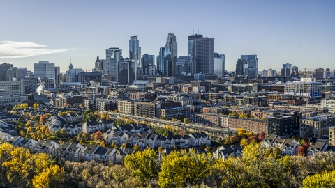 DXP001_000366 - Aerial stock photo of The city's skyline in the distance, seen from a neighborhood, Downtown Minneapolis, Minnesota