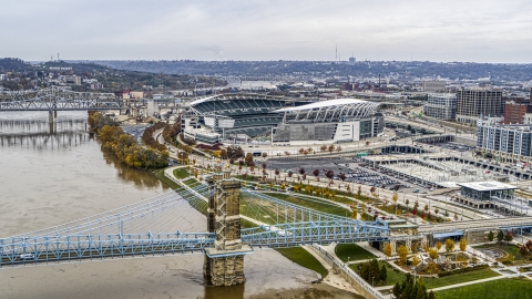 DXP001_000459 - Aerial stock photo of Paul Brown Stadium football field seen from Roebling Bridge and Ohio River in Downtown Cincinnati, Ohio