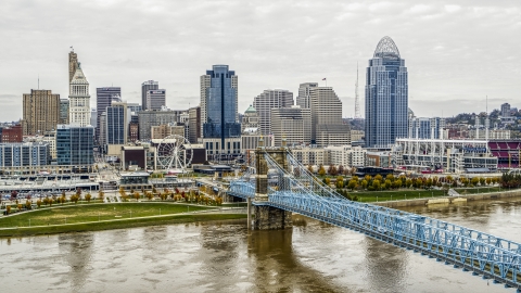 DXP001_000476 - Aerial stock photo of City's skyline and the Roebling Bridge across the Ohio River, Downtown Cincinnati, Ohio