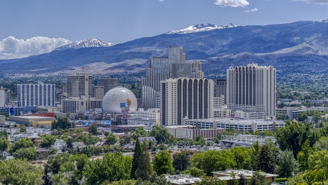 DXP001_004_0004 - Aerial stock photo of Hotels and casinos with mountains in the background in Reno, Nevada