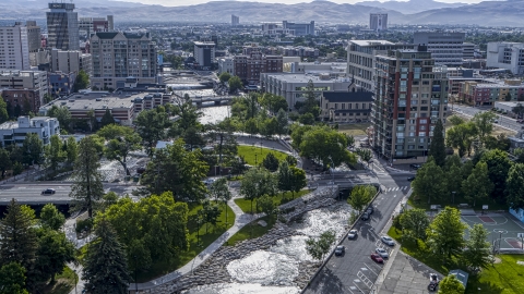 DXP001_006_0017 - Aerial stock photo of The Truckee River and Wingfield Park by office buildings in Reno, Nevada