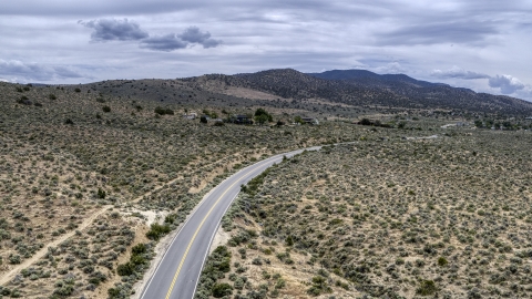 DXP001_007_0004 - Aerial stock photo of A desert road in Carson City, Nevada