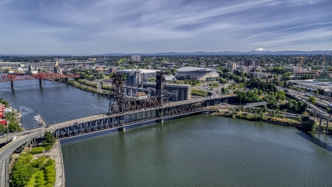 DXP001_012_0006 - Aerial stock photo of The Steel Bridge spanning the Willamette River near Moda Center arena, Northeast Portland, Oregon