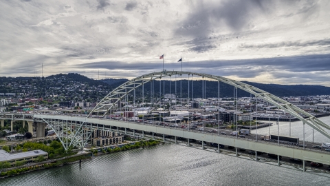 DXP001_013_0003 - Aerial stock photo of Traffic crossing the Fremont Bridge spanning the Willamette River in Downtown Portland, Oregon