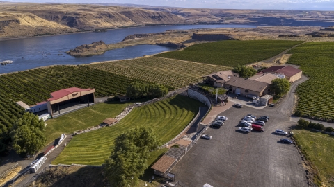 DXP001_018_0019 - Aerial stock photo of The Maryhill Winery, amphitheater, and vineyards beside the Columbia River in Goldendale, Washington