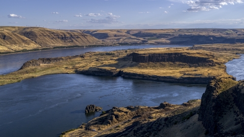 DXP001_019_0015 - Aerial stock photo of Miller Island and the Columbia River viewed from cliffs in Goldendale, Washington
