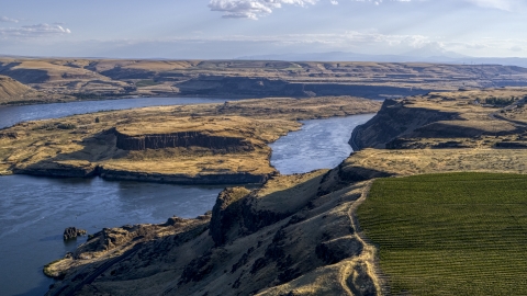 DXP001_019_0023 - Aerial stock photo of Miller Island and the Columbia River seen from cliff by Maryhill Winery in Goldendale, Washington