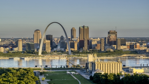 DXP001_021_0001 - Aerial stock photo of The Arch and city skyline across the Mississippi River at sunrise, Downtown St. Louis, Missouri