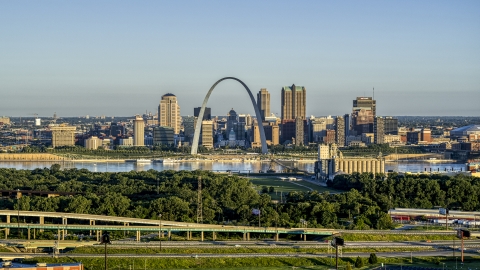 DXP001_021_0007 - Aerial stock photo of A view from the interstate of the Arch and skyline, sunrise, Downtown St. Louis, Missouri