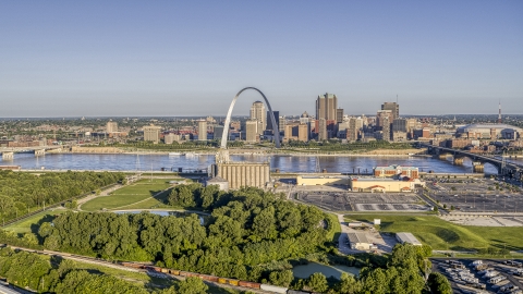 DXP001_022_0002 - Aerial stock photo of A park and grain elevator by the river with views of the Arch and skyline, Downtown St. Louis, Missouri