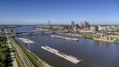 DXP001_023_0002 - Aerial stock photo of Barges in the river near the Gateway Arch in Downtown St. Louis, Missouri