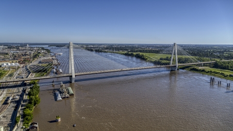 DXP001_023_0006 - Aerial stock photo of A cable-stayed bridge spanning the Mississippi River revealing barges, St. Louis, Missouri