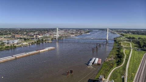 DXP001_023_0008 - Aerial stock photo of Barges on the river and a cable-stayed bridge, St. Louis, Missouri