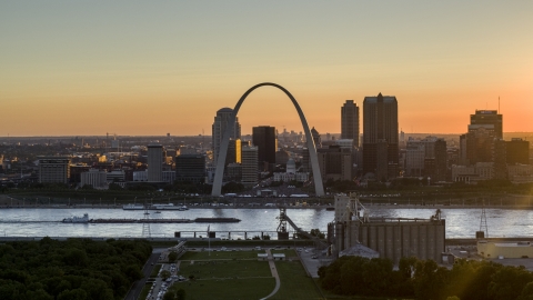 DXP001_029_0001 - Aerial stock photo of A view of the iconic Gateway Arch and Downtown St. Louis, Missouri at sunset