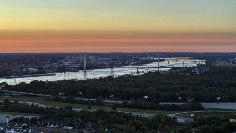 DXP001_029_0009 - Aerial stock photo of The Stan Musial Veterans Memorial Bridge and Mississippi River at sunset in St. Louis, Missouri