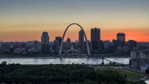 DXP001_029_0012 - Aerial stock photo of Gateway Arch and Downtown St. Louis, Missouri skyline in silhouette at sunset