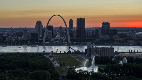 DXP001_029_0013 - Aerial stock photo of Gateway Arch across the river, seen from grain elevator and fountains, Downtown St. Louis, Missouri, twilight