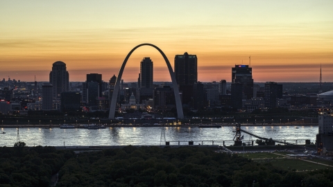 DXP001_030_0005 - Aerial stock photo of The Downtown St. Louis, Missouri skyline across the Mississippi River at twilight