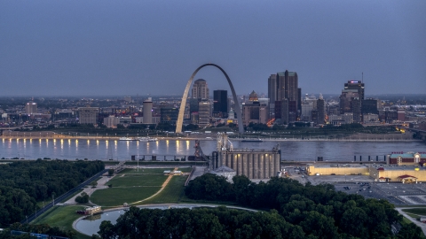DXP001_037_0002 - Aerial stock photo of The famous Gateway Arch at twilight, visible from across the Mississippi River, Downtown St. Louis, Missouri