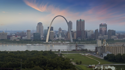 DXP001_037_0008 - Aerial stock photo of The Arch and skyline in Downtown St. Louis, Missouri, by Mississippi River at twilight