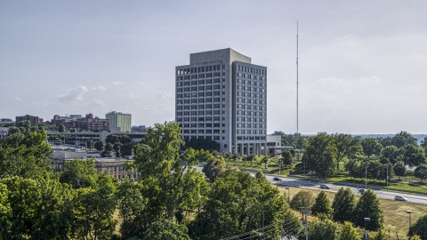 DXP001_044_0010 - Aerial stock photo of A government office building seen from trees in Kansas City, Missouri