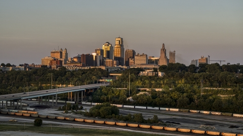 DXP001_046_0002 - Aerial stock photo of The city skyline at sunset seen from train tracks in Downtown Kansas City, Missouri
