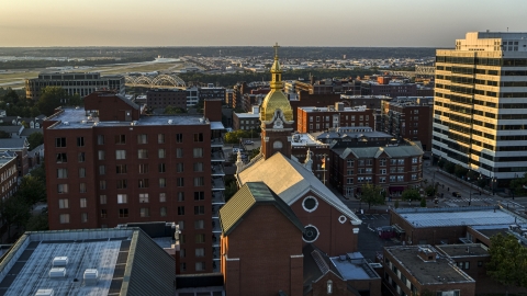 DXP001_051_0001 - Aerial stock photo of A cathedral steeple at sunset in Downtown Kansas City, Missouri