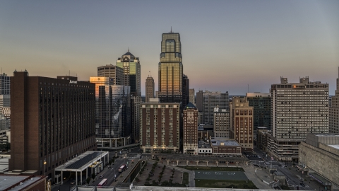DXP001_051_0013 - Aerial stock photo of Towering downtown skyscrapers at twilight in Downtown Kansas City, Missouri