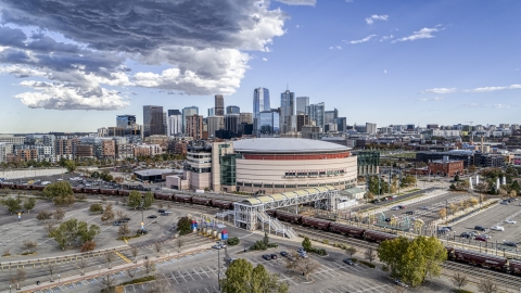 DXP001_056_0002 - Aerial stock photo of The Pepsi Center arena with the city skyline in the background, Downtown Denver, Colorado