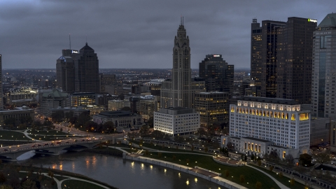 DXP001_087_0012 - Aerial stock photo of A view of LeVeque Tower across the river at twilight, Downtown Columbus, Ohio